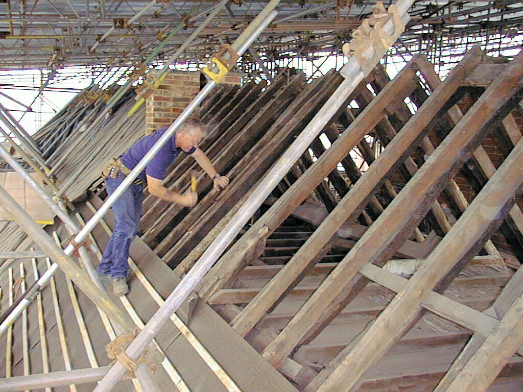 Placing new timber to support the rafters in number 123